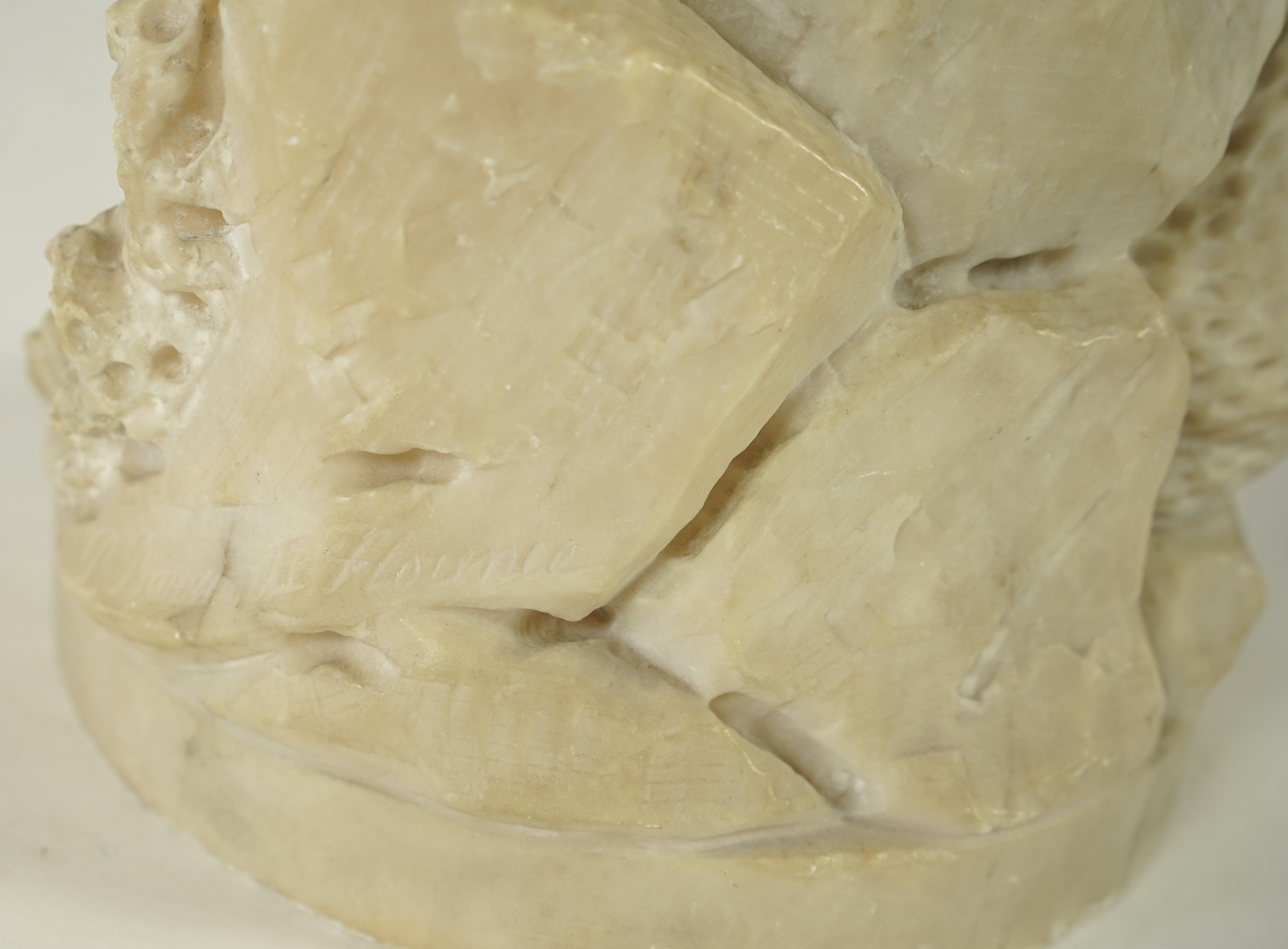 A Continental alabaster figure of a woman fishing, early 20th century